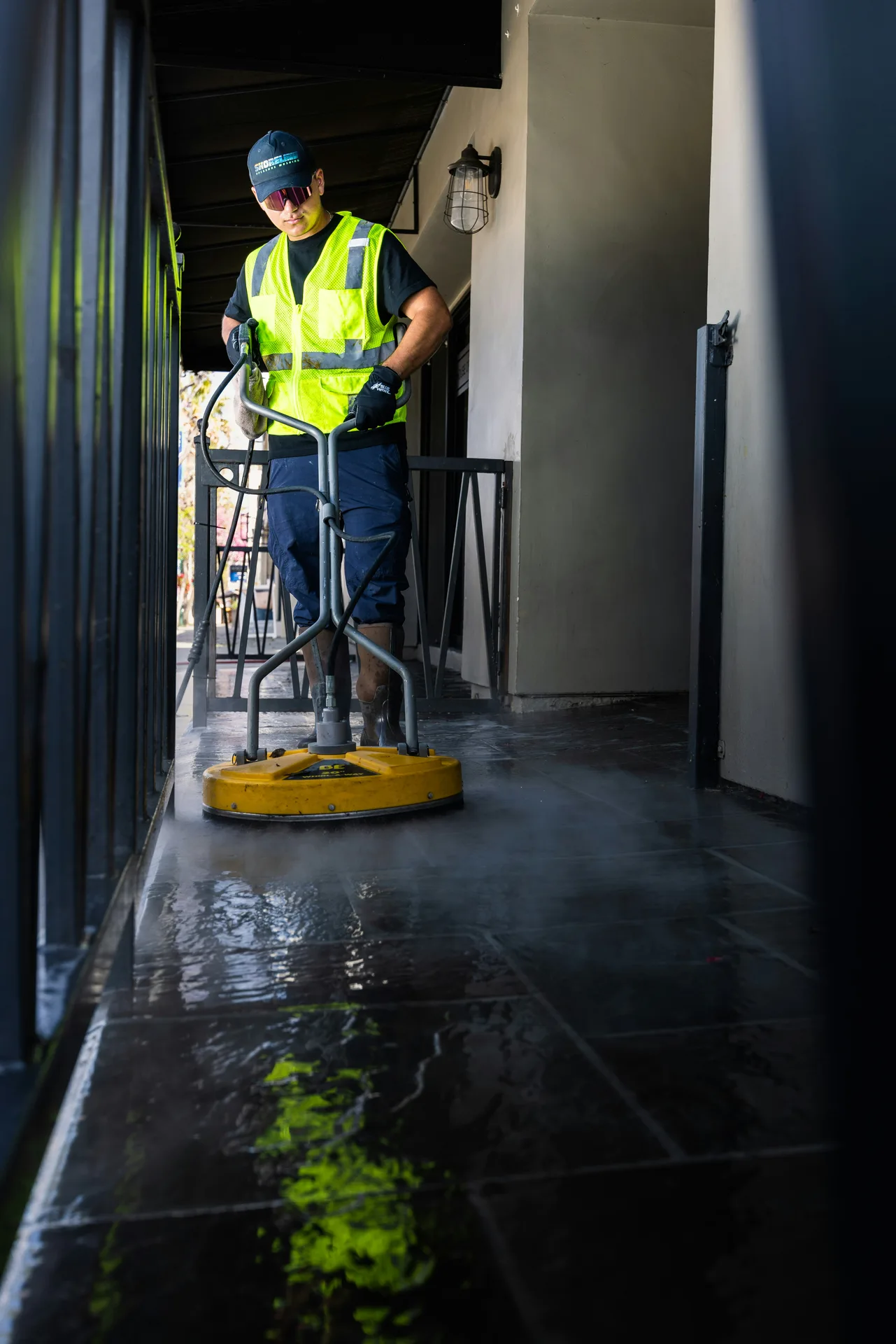Technician Using Surface Cleaner on /oil-stain-removal/ — London Pressure Washing London